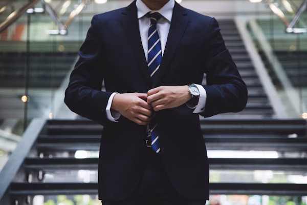Professional man in deep thought at desk